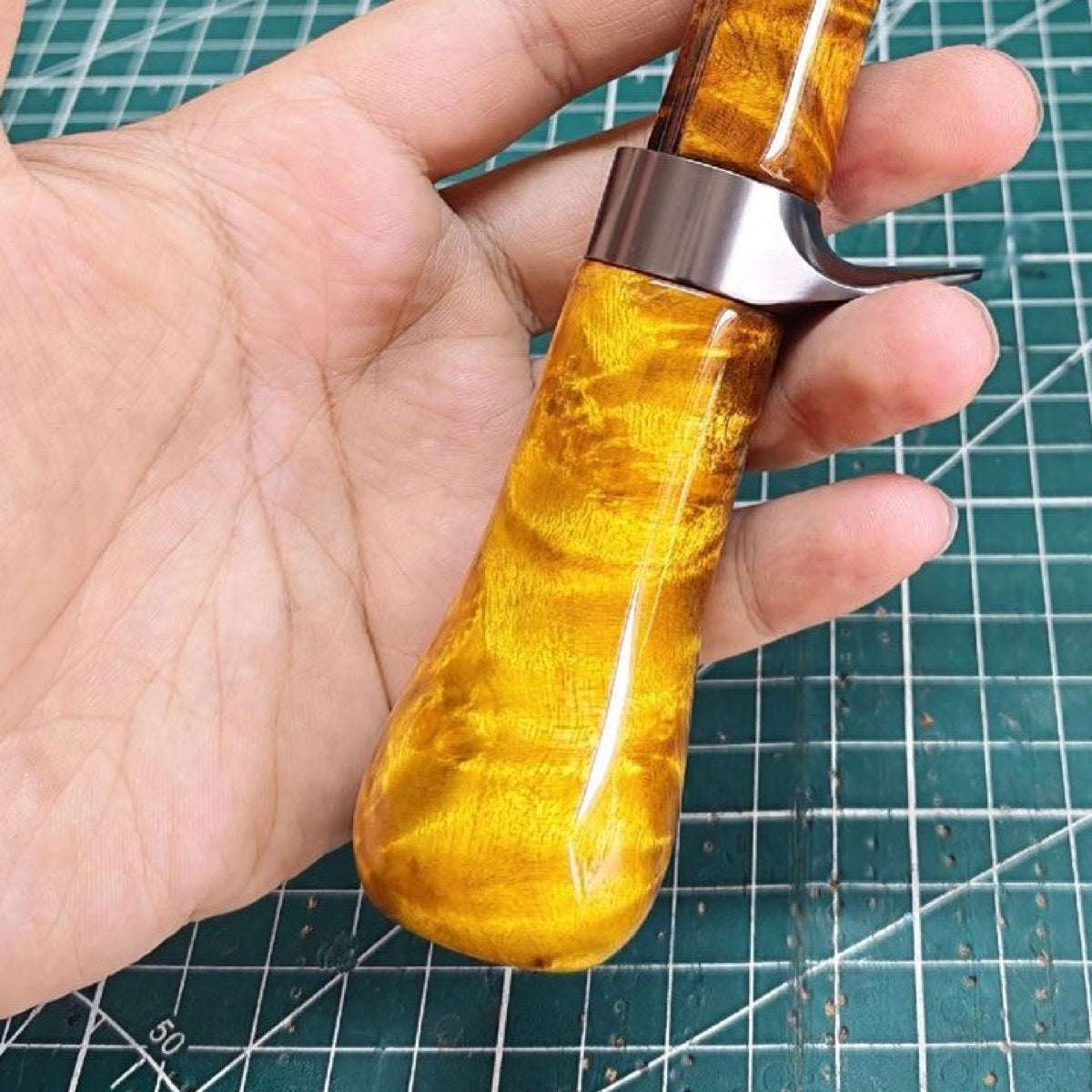 Golden-toned Huangjinzhang handle wood reference; natural grain varies.
