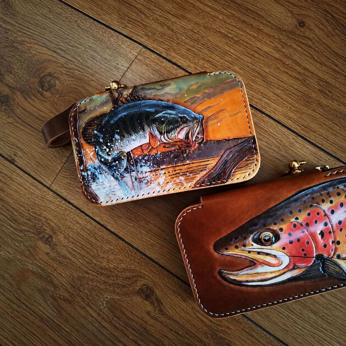Jumping-fish and spotted-fish leather wallet designs, sold individually