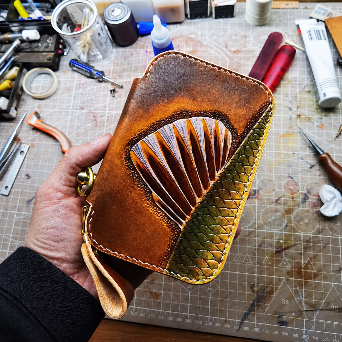 Fish fin and scale tooling with hand stitching and leather strap