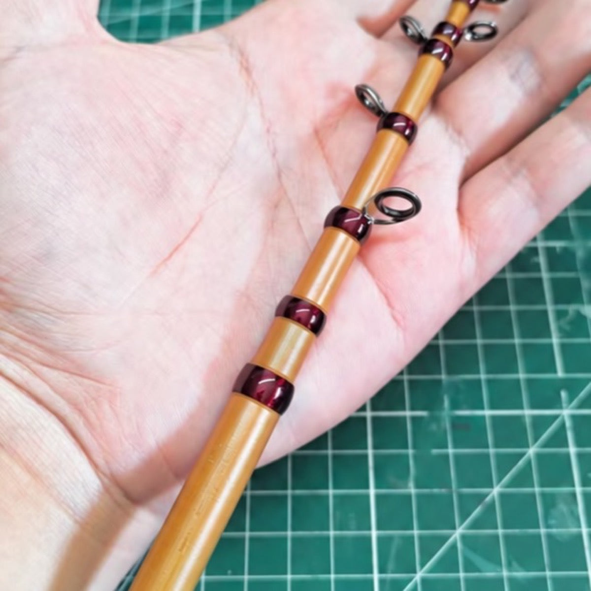 Custom compact telescopic travel rod — amber blank reference; example finish.