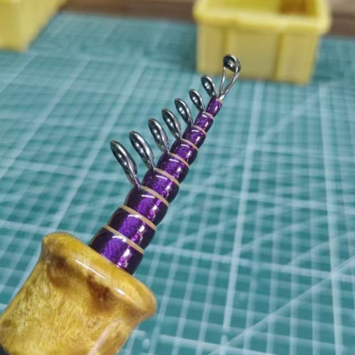Custom compact telescopic travel rod — purple wrap reference; example finish.