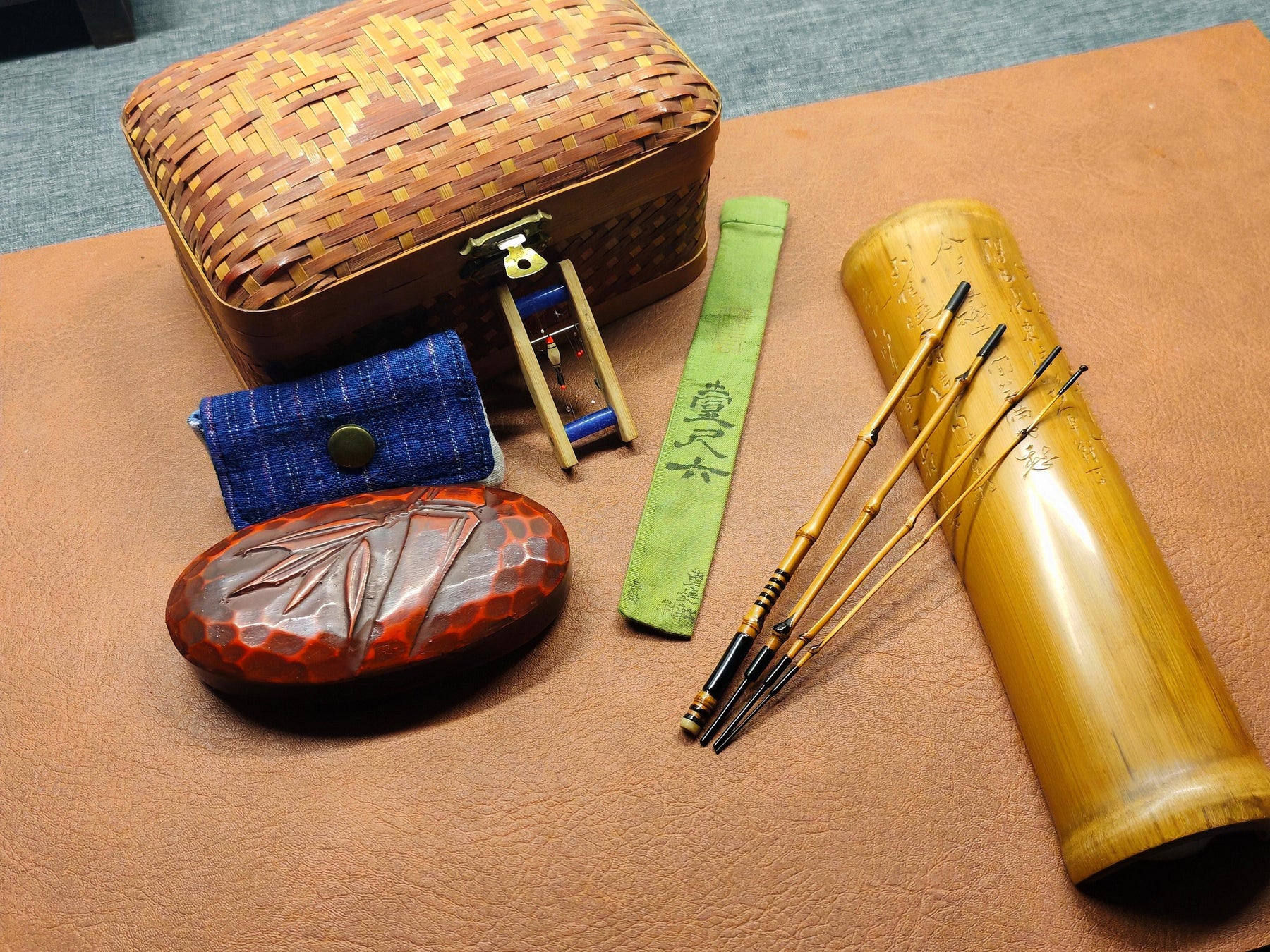Handmade tackle boxes, fishing tools, bamboo cases, and rods from the JFL Workshop